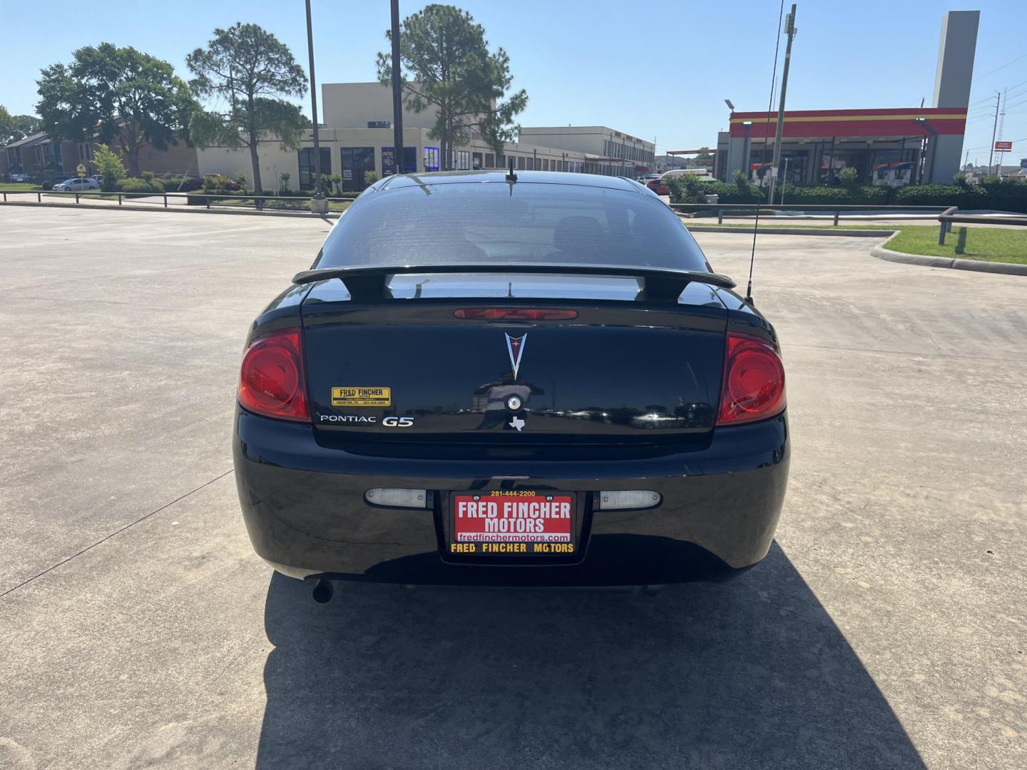 2009 black /Black Pontiac G5 Coupe (1G2AL18H097) with an 2.2L L4 DOHC 16V engine, 5-Speed Manual transmission, located at 14700 Tomball Parkway 249, Houston, TX, 77086, (281) 444-2200, 29.928619, -95.504074 - Photo#5