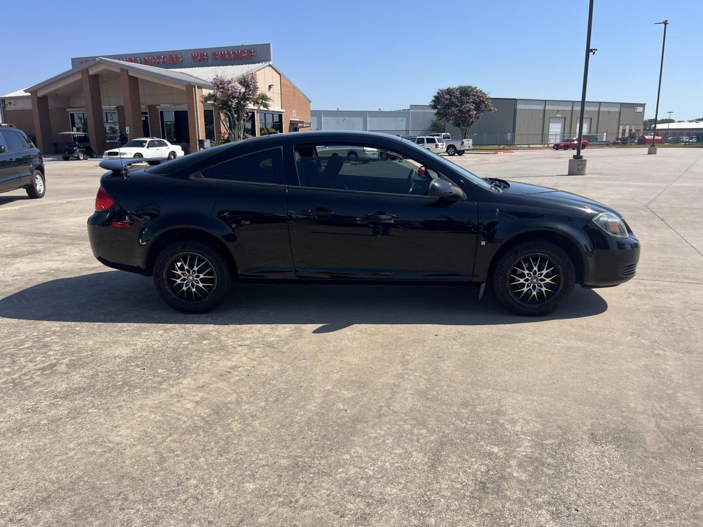 2009 black /Black Pontiac G5 Coupe (1G2AL18H097) with an 2.2L L4 DOHC 16V engine, 5-Speed Manual transmission, located at 14700 Tomball Parkway 249, Houston, TX, 77086, (281) 444-2200, 29.928619, -95.504074 - Photo#7