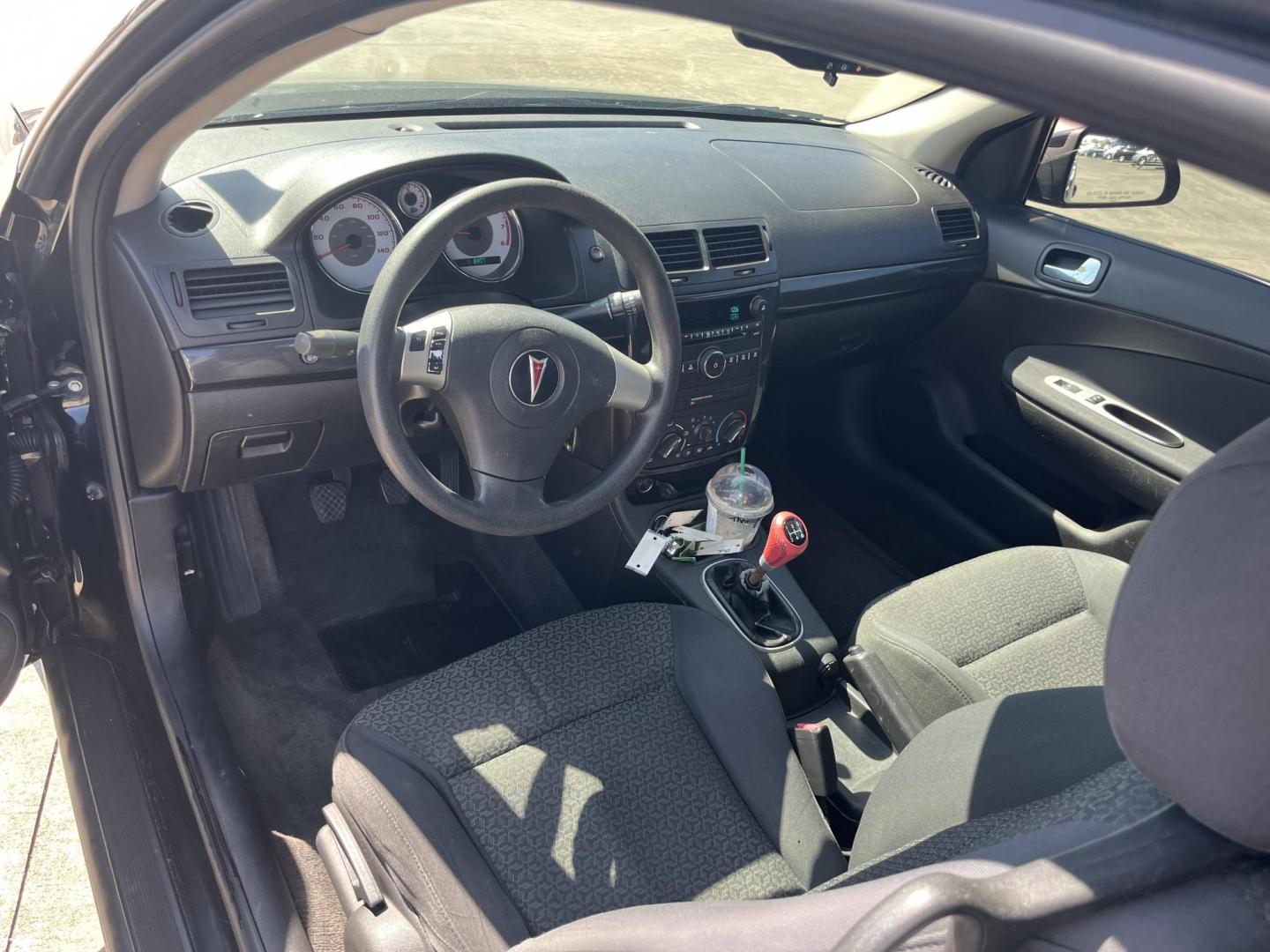 2009 black /Black Pontiac G5 Coupe (1G2AL18H097) with an 2.2L L4 DOHC 16V engine, 5-Speed Manual transmission, located at 14700 Tomball Parkway 249, Houston, TX, 77086, (281) 444-2200, 29.928619, -95.504074 - Photo#9