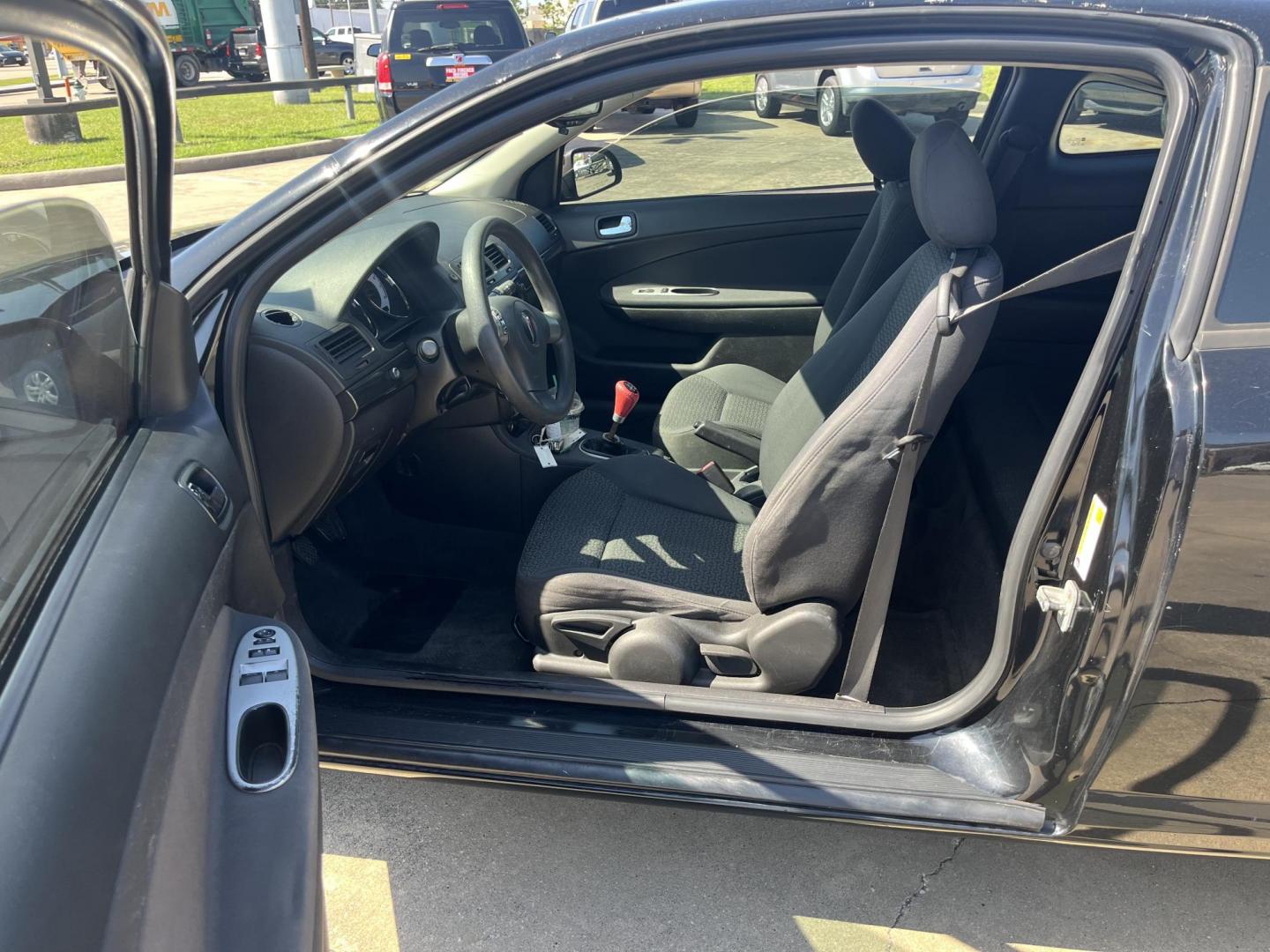 2009 black /Black Pontiac G5 Coupe (1G2AL18H097) with an 2.2L L4 DOHC 16V engine, 5-Speed Manual transmission, located at 14700 Tomball Parkway 249, Houston, TX, 77086, (281) 444-2200, 29.928619, -95.504074 - Photo#8