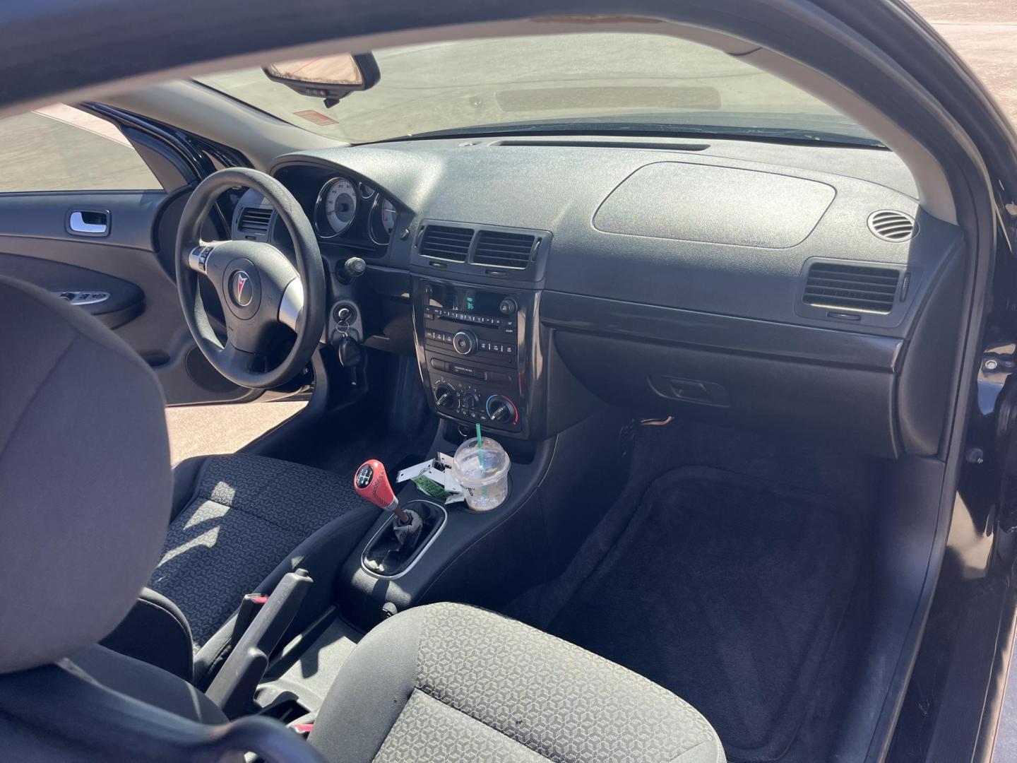2009 black /Black Pontiac G5 Coupe (1G2AL18H097) with an 2.2L L4 DOHC 16V engine, 5-Speed Manual transmission, located at 14700 Tomball Parkway 249, Houston, TX, 77086, (281) 444-2200, 29.928619, -95.504074 - Photo#12