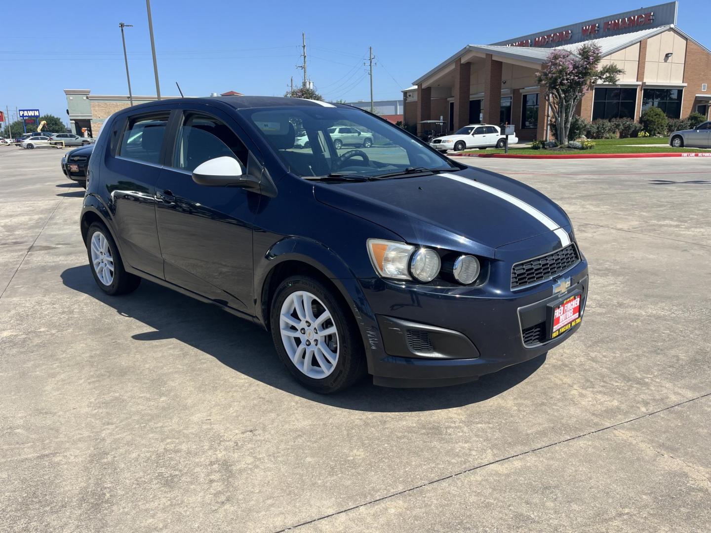 2016 blue /Black Chevrolet Sonic LT Auto 5-Door (1G1JC6SH1G4) with an 1.8L L4 DOHC 24V engine, 6A transmission, located at 14700 Tomball Parkway 249, Houston, TX, 77086, (281) 444-2200, 29.928619, -95.504074 - Photo#0