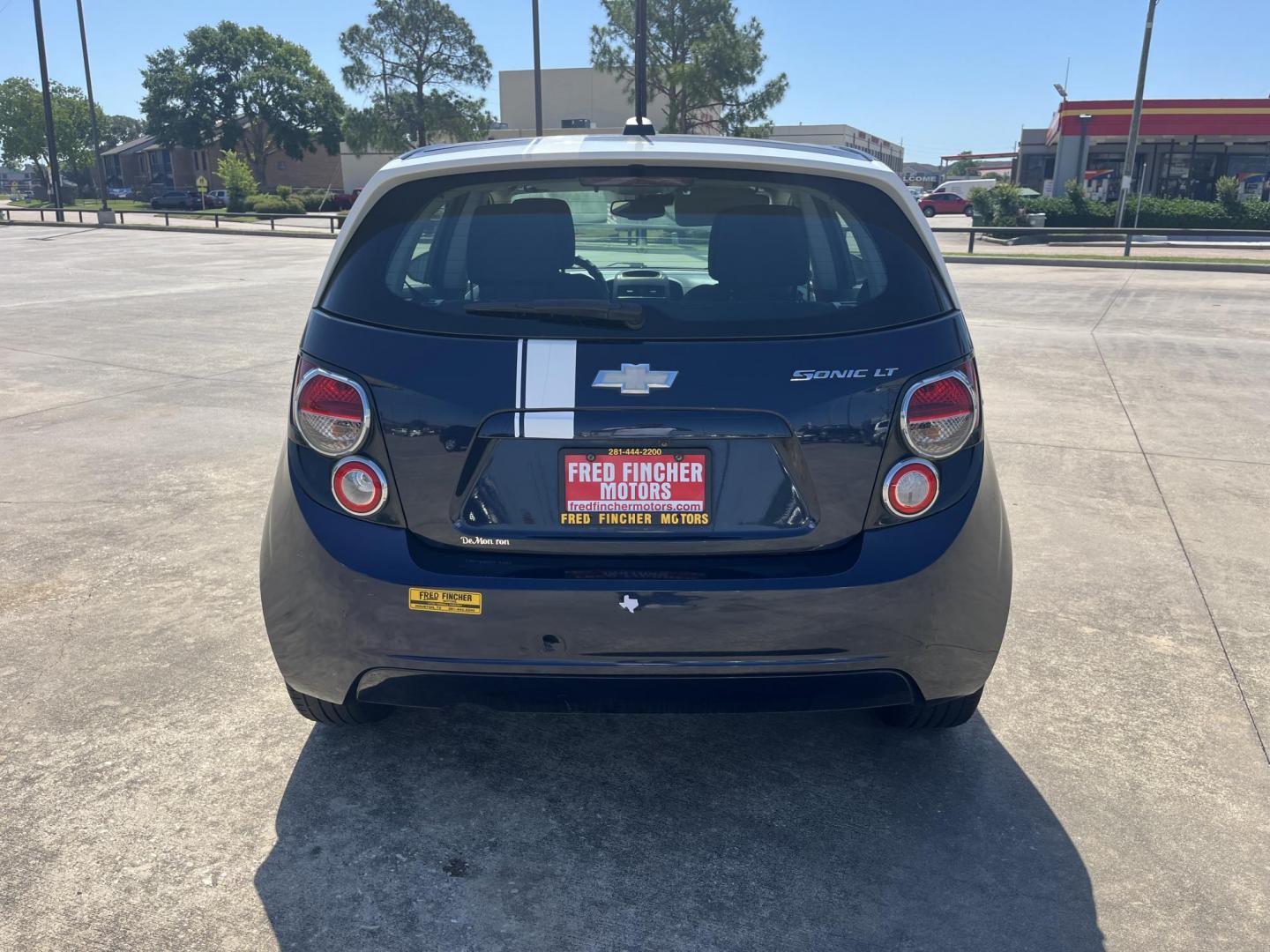 2016 blue /Black Chevrolet Sonic LT Auto 5-Door (1G1JC6SH1G4) with an 1.8L L4 DOHC 24V engine, 6A transmission, located at 14700 Tomball Parkway 249, Houston, TX, 77086, (281) 444-2200, 29.928619, -95.504074 - Photo#5