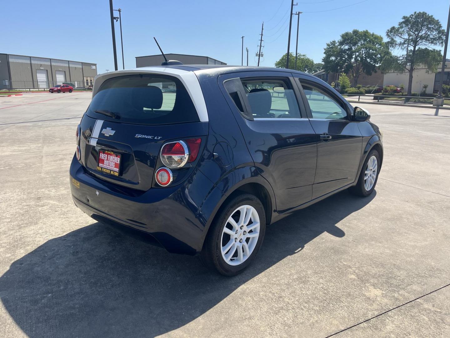 2016 blue /Black Chevrolet Sonic LT Auto 5-Door (1G1JC6SH1G4) with an 1.8L L4 DOHC 24V engine, 6A transmission, located at 14700 Tomball Parkway 249, Houston, TX, 77086, (281) 444-2200, 29.928619, -95.504074 - Photo#6