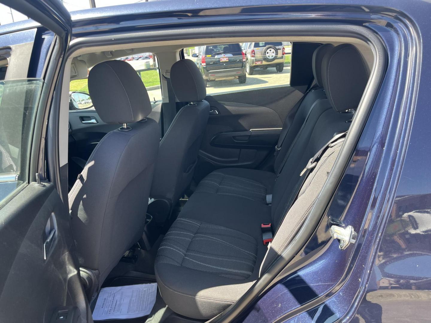 2016 blue /Black Chevrolet Sonic LT Auto 5-Door (1G1JC6SH1G4) with an 1.8L L4 DOHC 24V engine, 6A transmission, located at 14700 Tomball Parkway 249, Houston, TX, 77086, (281) 444-2200, 29.928619, -95.504074 - Photo#9