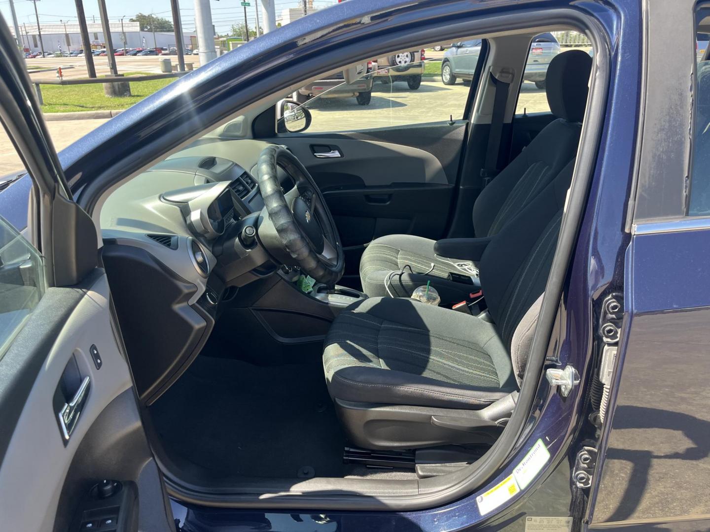 2016 blue /Black Chevrolet Sonic LT Auto 5-Door (1G1JC6SH1G4) with an 1.8L L4 DOHC 24V engine, 6A transmission, located at 14700 Tomball Parkway 249, Houston, TX, 77086, (281) 444-2200, 29.928619, -95.504074 - Photo#8