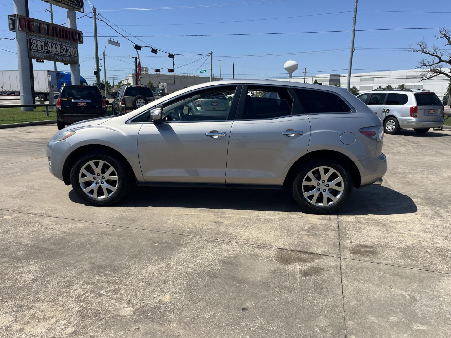2009 Green /Black Mazda CX-7 Grand Touring AWD (JM3ER293890) with an 2.3L L4 DOHC 16V TURBO engine, 6-Speed Automatic transmission, located at 14700 Tomball Parkway 249, Houston, TX, 77086, (281) 444-2200, 29.928619, -95.504074 - Photo#3