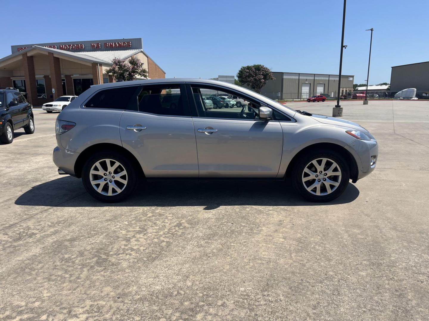 2009 Green /Black Mazda CX-7 Grand Touring AWD (JM3ER293890) with an 2.3L L4 DOHC 16V TURBO engine, 6-Speed Automatic transmission, located at 14700 Tomball Parkway 249, Houston, TX, 77086, (281) 444-2200, 29.928619, -95.504074 - Photo#7