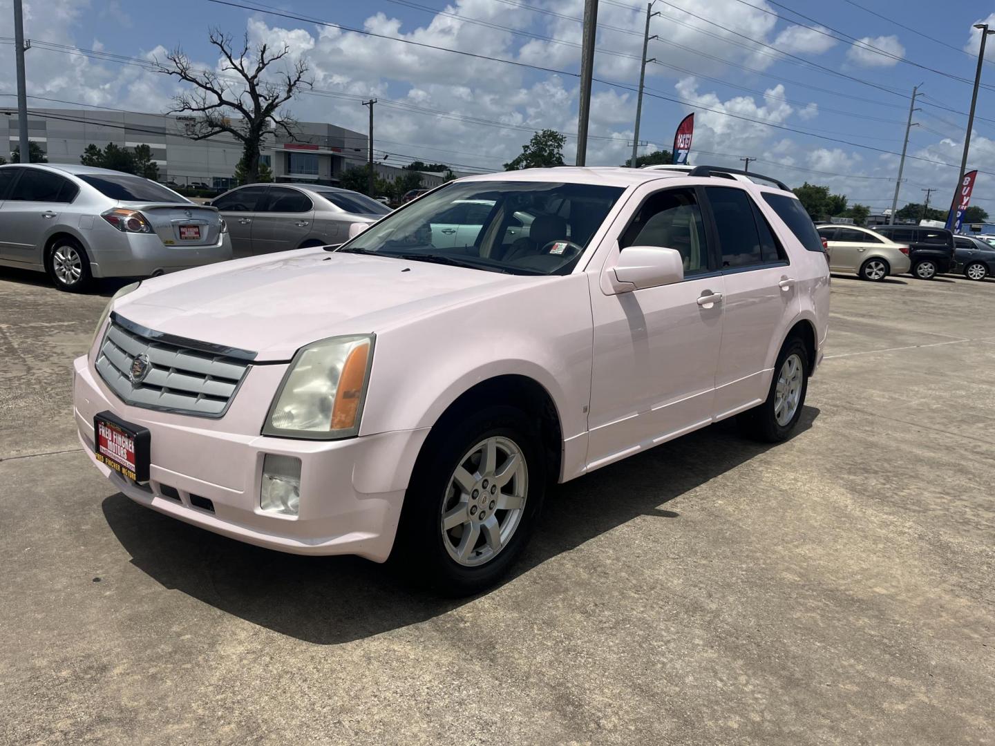 2008 Pink /Tan Cadillac SRX V6 AWD (1GYEE437280) with an 3.6L V6 OHV 24V engine, 5-Speed Automatic Overdrive transmission, located at 14700 Tomball Parkway 249, Houston, TX, 77086, (281) 444-2200, 29.928619, -95.504074 - Photo#2
