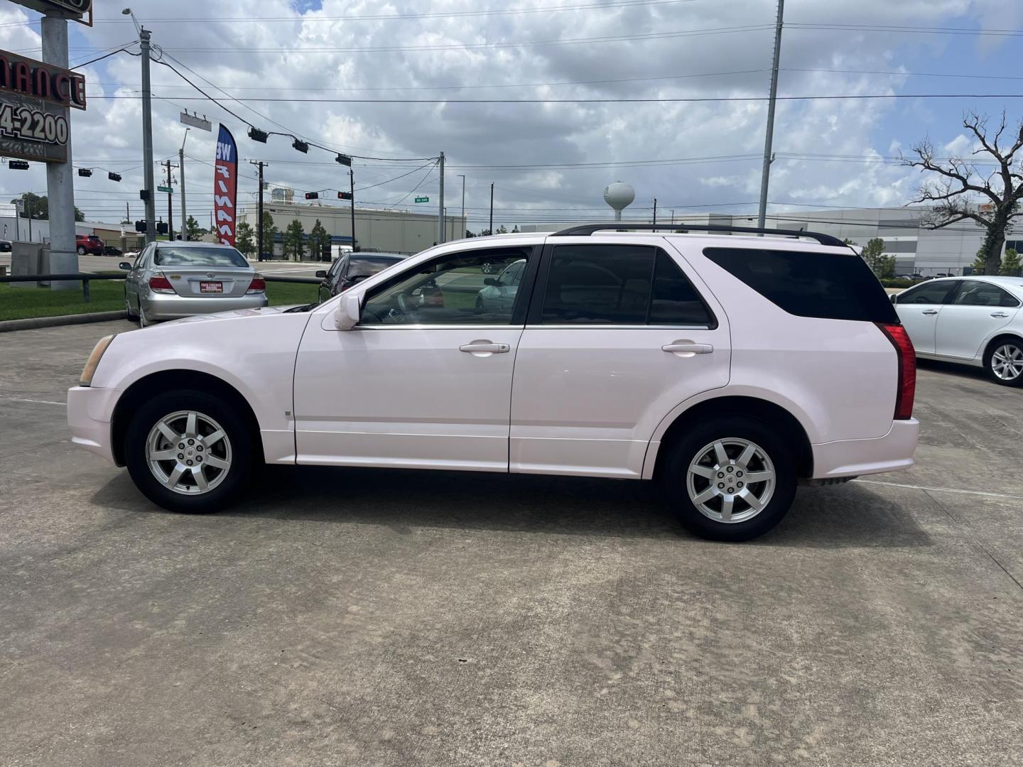 2008 Pink /Tan Cadillac SRX V6 AWD (1GYEE437280) with an 3.6L V6 OHV 24V engine, 5-Speed Automatic Overdrive transmission, located at 14700 Tomball Parkway 249, Houston, TX, 77086, (281) 444-2200, 29.928619, -95.504074 - Photo#3