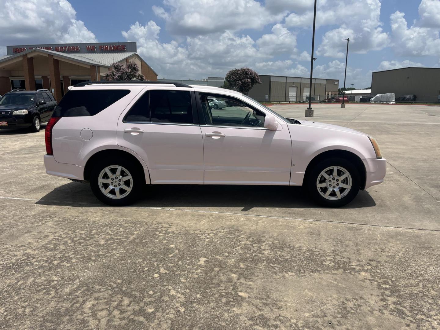 2008 Pink /Tan Cadillac SRX V6 AWD (1GYEE437280) with an 3.6L V6 OHV 24V engine, 5-Speed Automatic Overdrive transmission, located at 14700 Tomball Parkway 249, Houston, TX, 77086, (281) 444-2200, 29.928619, -95.504074 - Photo#7