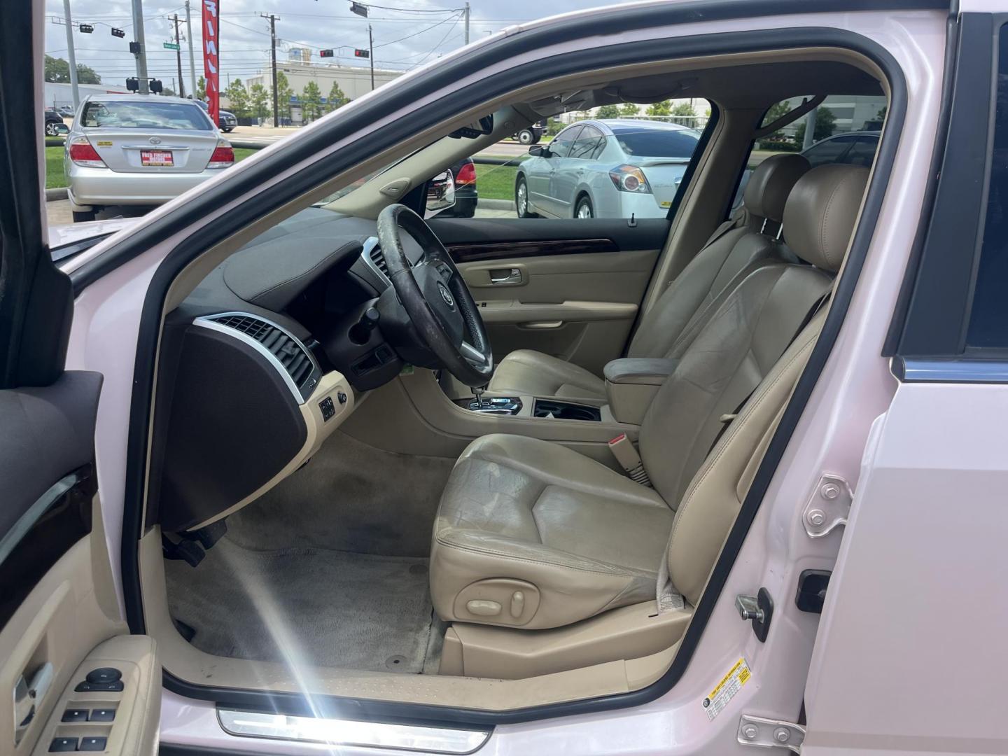 2008 Pink /Tan Cadillac SRX V6 AWD (1GYEE437280) with an 3.6L V6 OHV 24V engine, 5-Speed Automatic Overdrive transmission, located at 14700 Tomball Parkway 249, Houston, TX, 77086, (281) 444-2200, 29.928619, -95.504074 - Photo#8