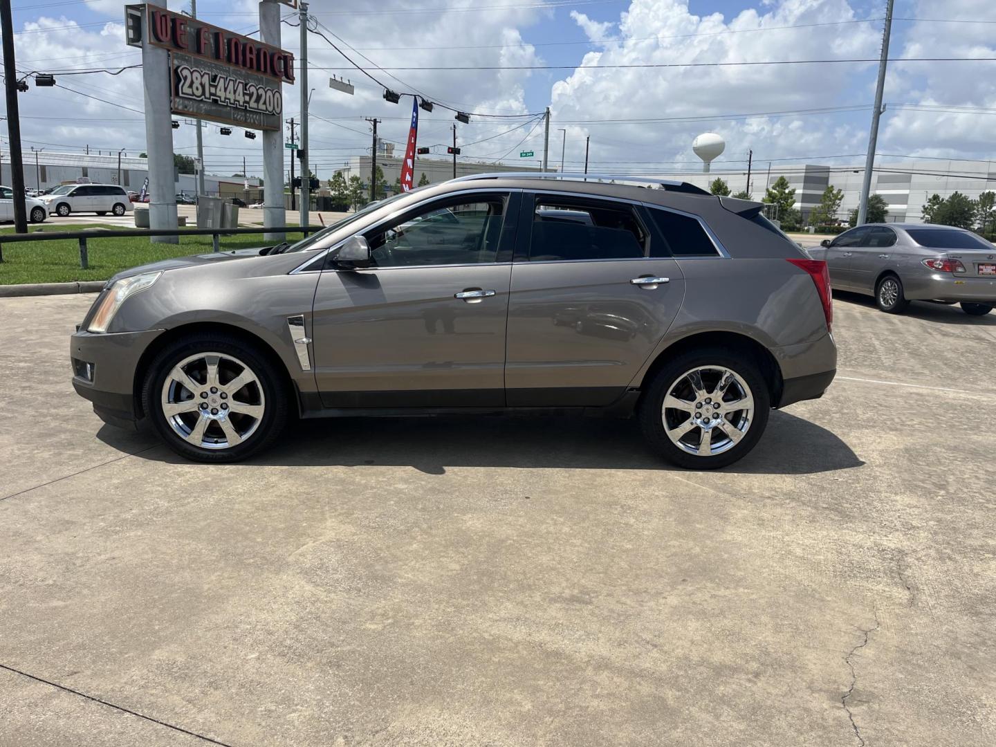 2012 Brown /Tan Cadillac SRX Performance (3GYFNBE39CS) with an 3.6L V6 DOHC 24V FFV engine, 6-Speed Automatic transmission, located at 14700 Tomball Parkway 249, Houston, TX, 77086, (281) 444-2200, 29.928619, -95.504074 - Photo#3