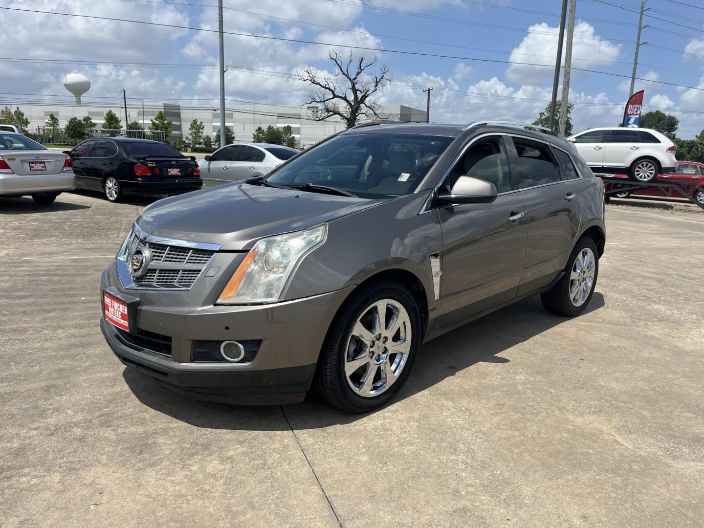 2012 Brown /Tan Cadillac SRX Performance (3GYFNBE39CS) with an 3.6L V6 DOHC 24V FFV engine, 6-Speed Automatic transmission, located at 14700 Tomball Parkway 249, Houston, TX, 77086, (281) 444-2200, 29.928619, -95.504074 - Photo#2