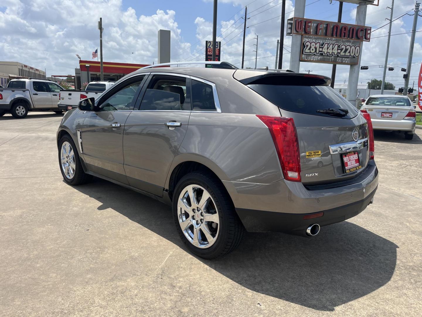 2012 Brown /Tan Cadillac SRX Performance (3GYFNBE39CS) with an 3.6L V6 DOHC 24V FFV engine, 6-Speed Automatic transmission, located at 14700 Tomball Parkway 249, Houston, TX, 77086, (281) 444-2200, 29.928619, -95.504074 - Photo#4