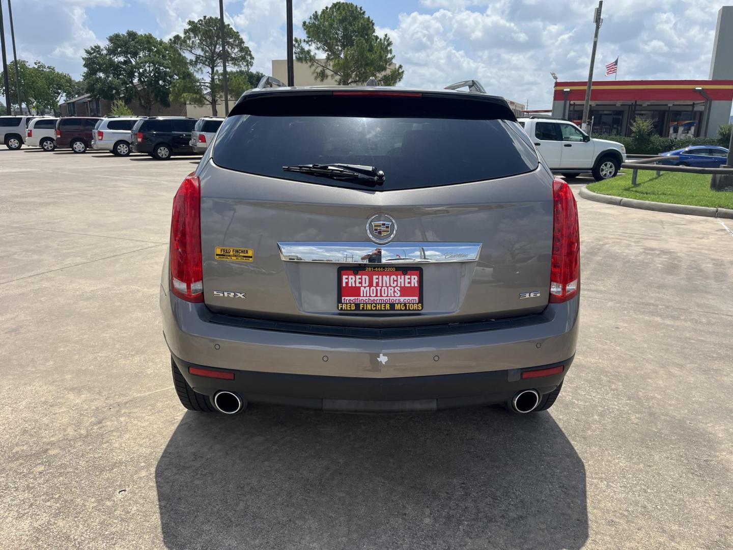 2012 Brown /Tan Cadillac SRX Performance (3GYFNBE39CS) with an 3.6L V6 DOHC 24V FFV engine, 6-Speed Automatic transmission, located at 14700 Tomball Parkway 249, Houston, TX, 77086, (281) 444-2200, 29.928619, -95.504074 - Photo#5