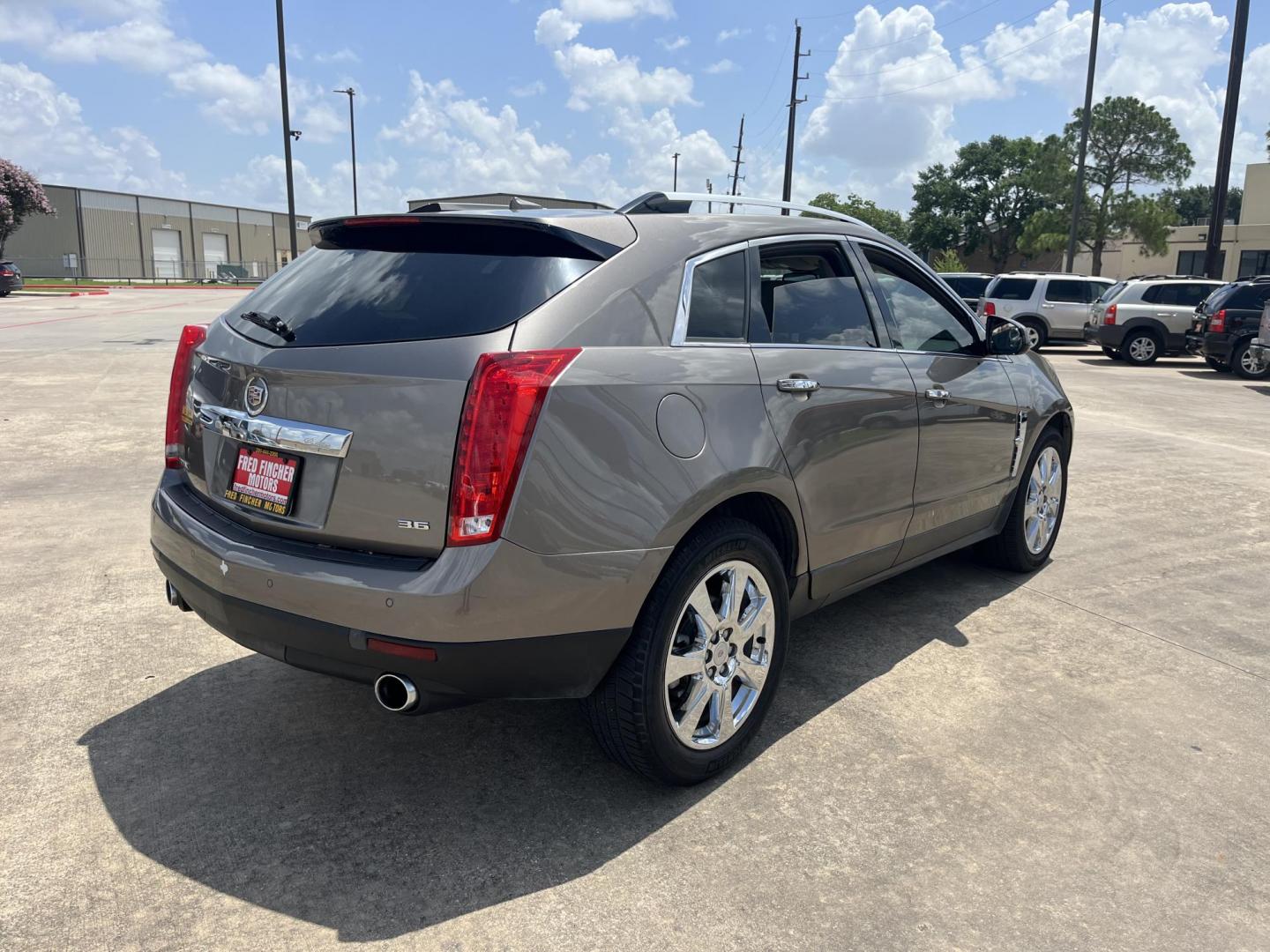 2012 Brown /Tan Cadillac SRX Performance (3GYFNBE39CS) with an 3.6L V6 DOHC 24V FFV engine, 6-Speed Automatic transmission, located at 14700 Tomball Parkway 249, Houston, TX, 77086, (281) 444-2200, 29.928619, -95.504074 - Photo#6