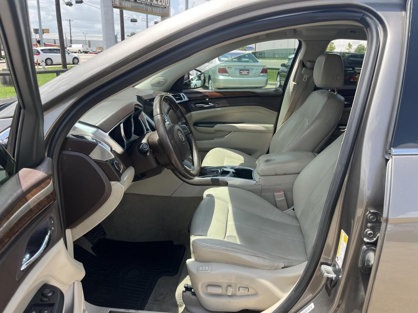 2012 Brown /Tan Cadillac SRX Performance (3GYFNBE39CS) with an 3.6L V6 DOHC 24V FFV engine, 6-Speed Automatic transmission, located at 14700 Tomball Parkway 249, Houston, TX, 77086, (281) 444-2200, 29.928619, -95.504074 - Photo#8