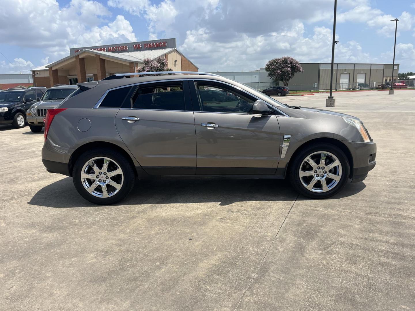2012 Brown /Tan Cadillac SRX Performance (3GYFNBE39CS) with an 3.6L V6 DOHC 24V FFV engine, 6-Speed Automatic transmission, located at 14700 Tomball Parkway 249, Houston, TX, 77086, (281) 444-2200, 29.928619, -95.504074 - Photo#7