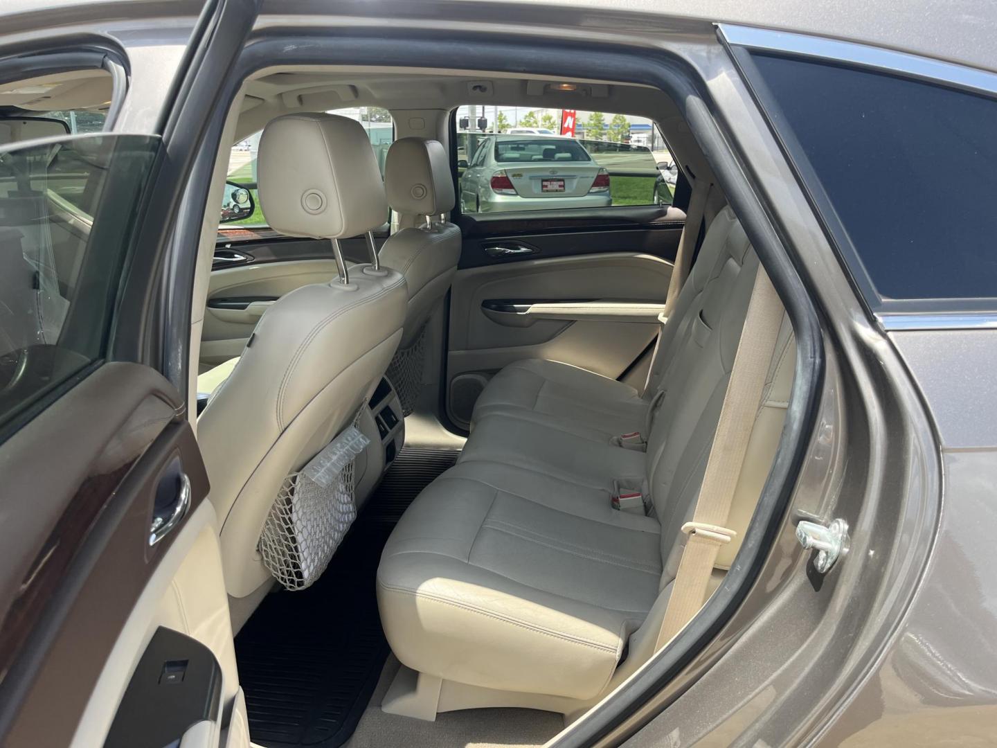 2012 Brown /Tan Cadillac SRX Performance (3GYFNBE39CS) with an 3.6L V6 DOHC 24V FFV engine, 6-Speed Automatic transmission, located at 14700 Tomball Parkway 249, Houston, TX, 77086, (281) 444-2200, 29.928619, -95.504074 - Photo#9