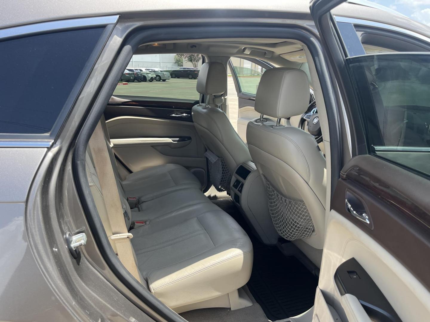 2012 Brown /Tan Cadillac SRX Performance (3GYFNBE39CS) with an 3.6L V6 DOHC 24V FFV engine, 6-Speed Automatic transmission, located at 14700 Tomball Parkway 249, Houston, TX, 77086, (281) 444-2200, 29.928619, -95.504074 - Photo#12