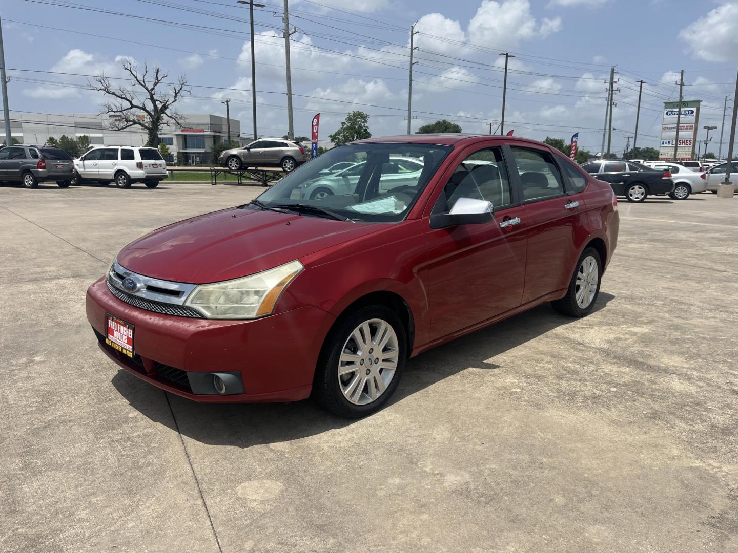 2010 red Ford Focus SEL Sedan (1FAHP3HN8AW) with an 2.0L L4 DOHC 16V engine, Auto transmission, located at 14700 Tomball Parkway 249, Houston, TX, 77086, (281) 444-2200, 29.928619, -95.504074 - Photo#2