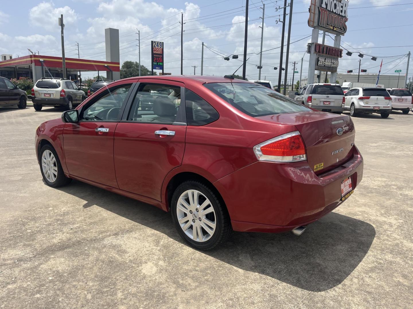 2010 red Ford Focus SEL Sedan (1FAHP3HN8AW) with an 2.0L L4 DOHC 16V engine, Auto transmission, located at 14700 Tomball Parkway 249, Houston, TX, 77086, (281) 444-2200, 29.928619, -95.504074 - Photo#4