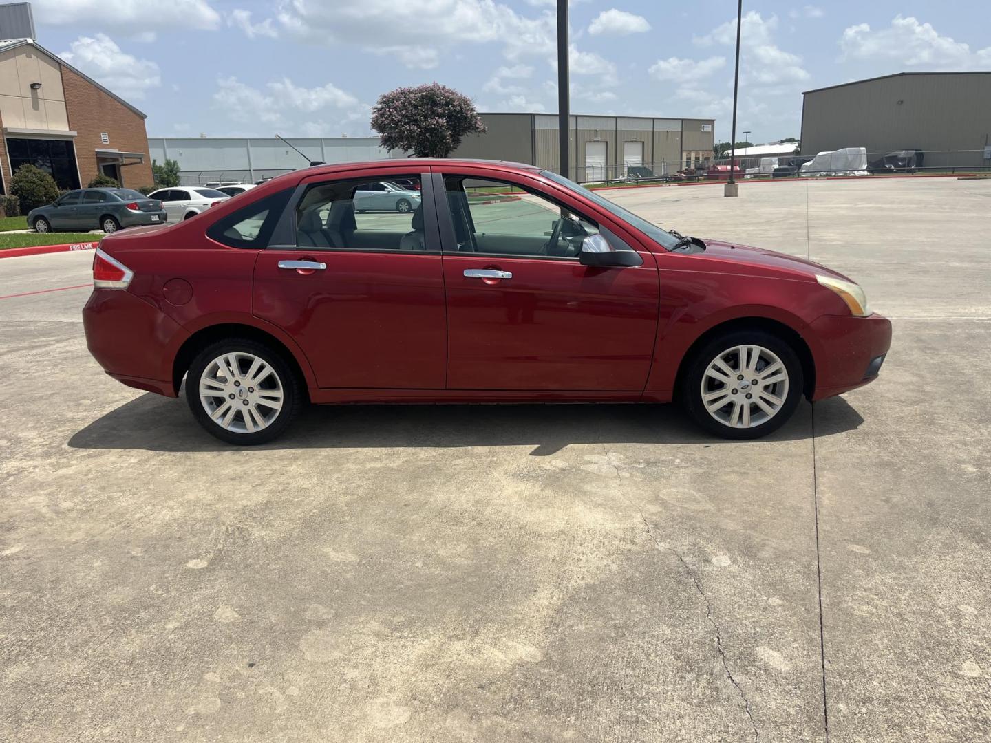 2010 red Ford Focus SEL Sedan (1FAHP3HN8AW) with an 2.0L L4 DOHC 16V engine, Auto transmission, located at 14700 Tomball Parkway 249, Houston, TX, 77086, (281) 444-2200, 29.928619, -95.504074 - Photo#7