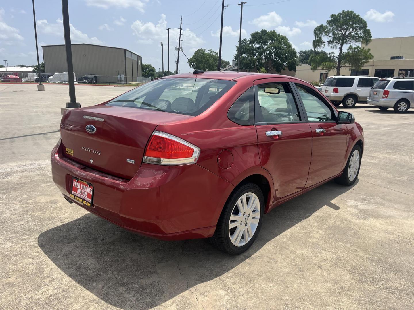 2010 red Ford Focus SEL Sedan (1FAHP3HN8AW) with an 2.0L L4 DOHC 16V engine, Auto transmission, located at 14700 Tomball Parkway 249, Houston, TX, 77086, (281) 444-2200, 29.928619, -95.504074 - Photo#6