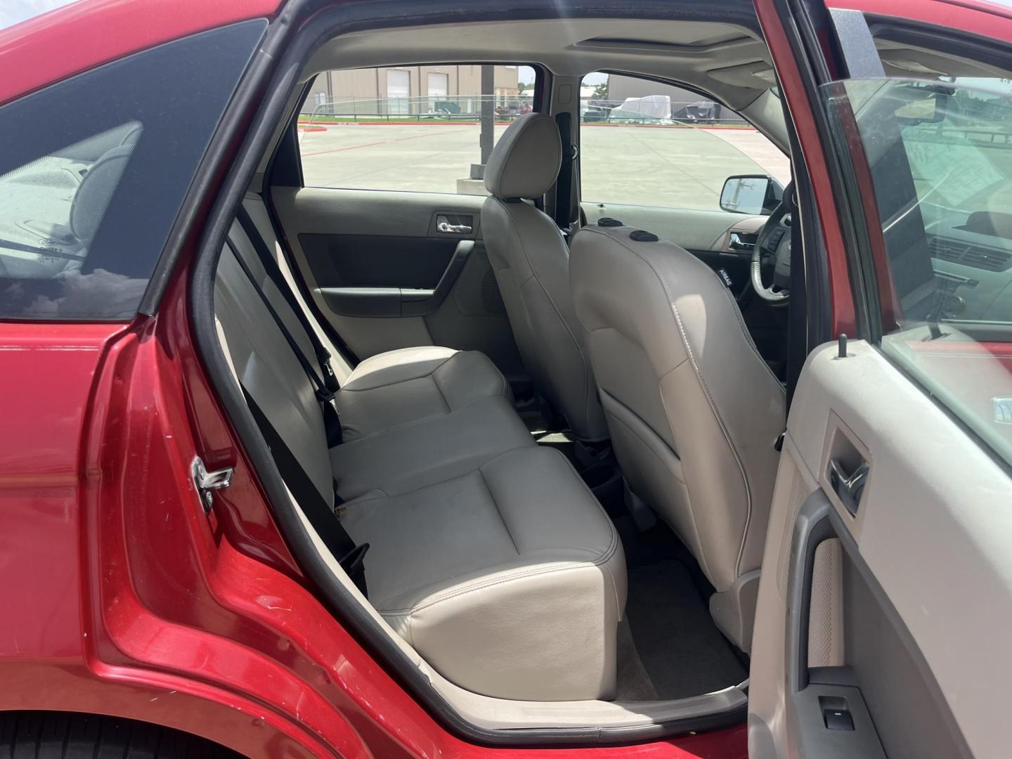 2010 red Ford Focus SEL Sedan (1FAHP3HN8AW) with an 2.0L L4 DOHC 16V engine, Auto transmission, located at 14700 Tomball Parkway 249, Houston, TX, 77086, (281) 444-2200, 29.928619, -95.504074 - Photo#12