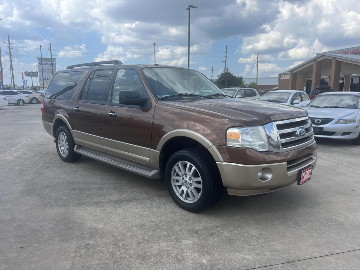 2011 Brown Ford Expedition EL King Ranch 2WD (1FMJK1H5XBE) with an 5.4L V8 SOHC 16V FFV engine, 6-Speed Automatic transmission, located at 14700 Tomball Parkway 249, Houston, TX, 77086, (281) 444-2200, 29.928619, -95.504074 - Photo#0