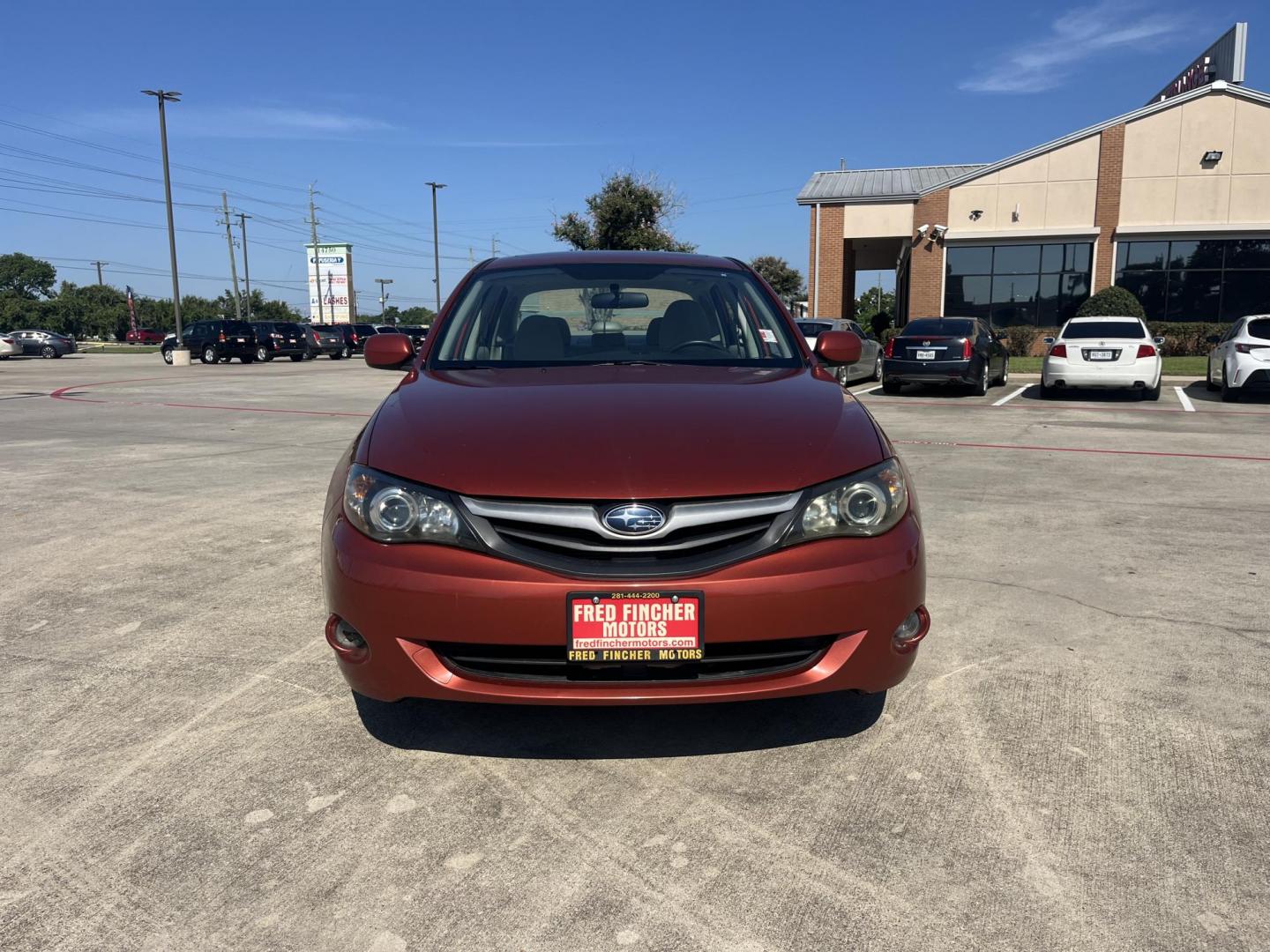 2010 Orange Subaru Impreza 2.5i Premium 4-Door (JF1GE6B60AH) with an 2.5L H4 SOHC 16V engine, Auto transmission, located at 14700 Tomball Parkway 249, Houston, TX, 77086, (281) 444-2200, 29.928619, -95.504074 - Photo#1