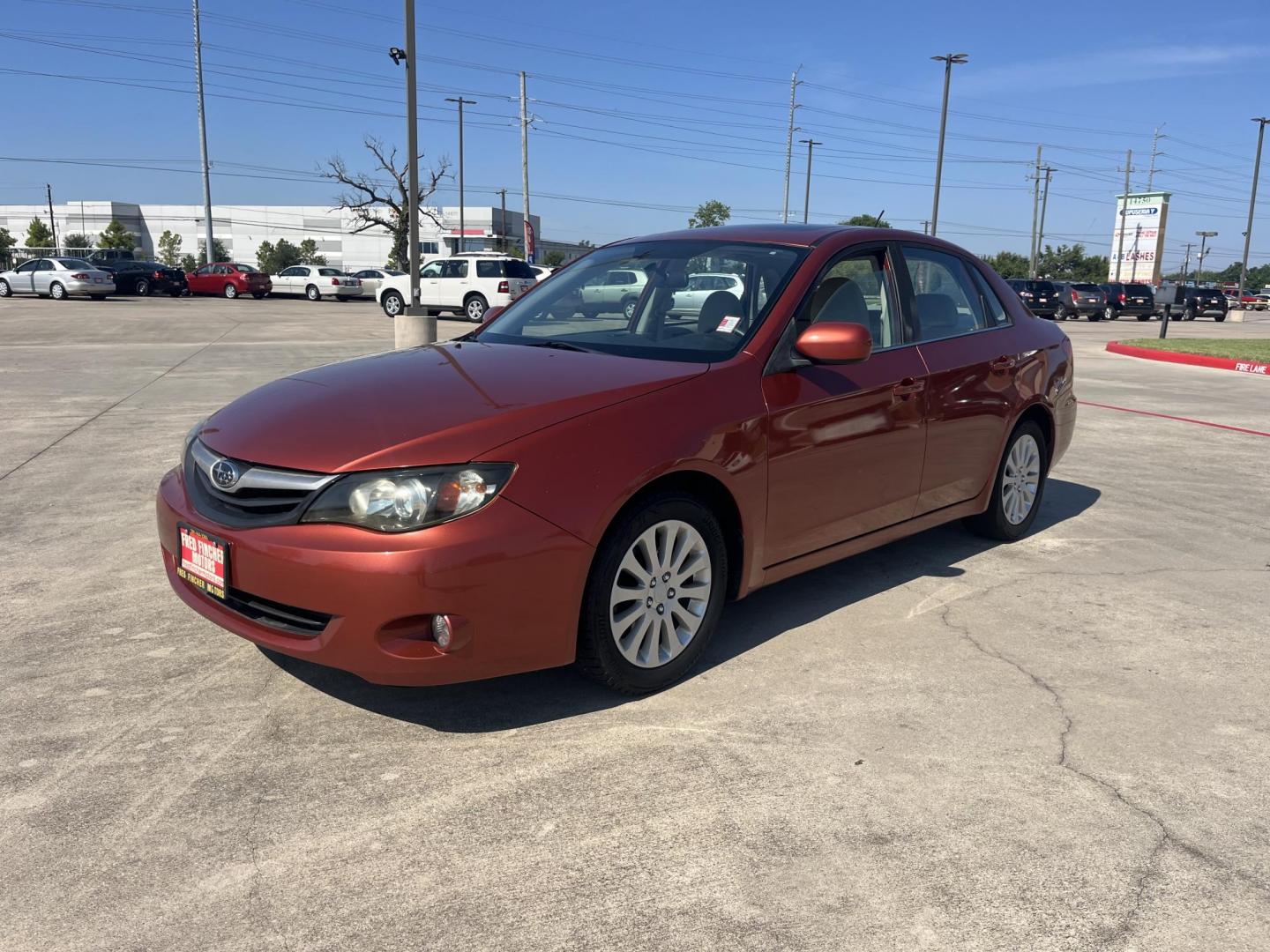 2010 Orange Subaru Impreza 2.5i Premium 4-Door (JF1GE6B60AH) with an 2.5L H4 SOHC 16V engine, Auto transmission, located at 14700 Tomball Parkway 249, Houston, TX, 77086, (281) 444-2200, 29.928619, -95.504074 - Photo#2