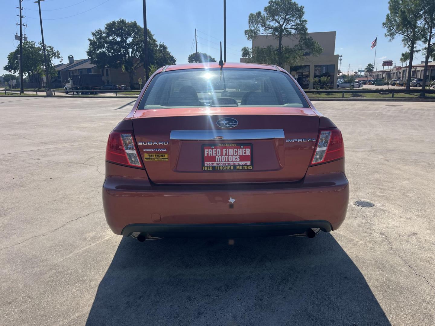 2010 Orange Subaru Impreza 2.5i Premium 4-Door (JF1GE6B60AH) with an 2.5L H4 SOHC 16V engine, Auto transmission, located at 14700 Tomball Parkway 249, Houston, TX, 77086, (281) 444-2200, 29.928619, -95.504074 - Photo#5