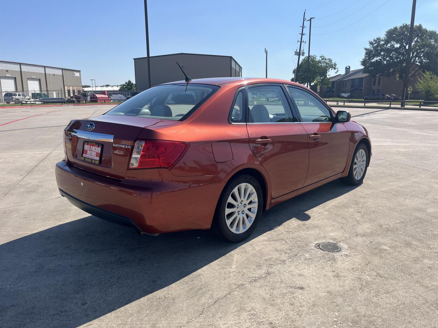 2010 Orange Subaru Impreza 2.5i Premium 4-Door (JF1GE6B60AH) with an 2.5L H4 SOHC 16V engine, Auto transmission, located at 14700 Tomball Parkway 249, Houston, TX, 77086, (281) 444-2200, 29.928619, -95.504074 - Photo#6