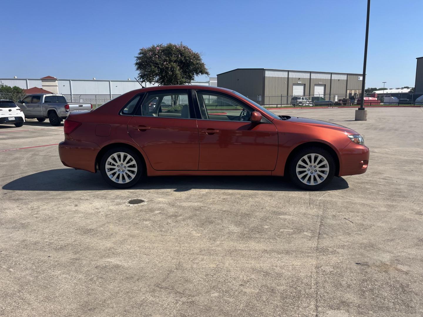 2010 Orange Subaru Impreza 2.5i Premium 4-Door (JF1GE6B60AH) with an 2.5L H4 SOHC 16V engine, Auto transmission, located at 14700 Tomball Parkway 249, Houston, TX, 77086, (281) 444-2200, 29.928619, -95.504074 - Photo#7