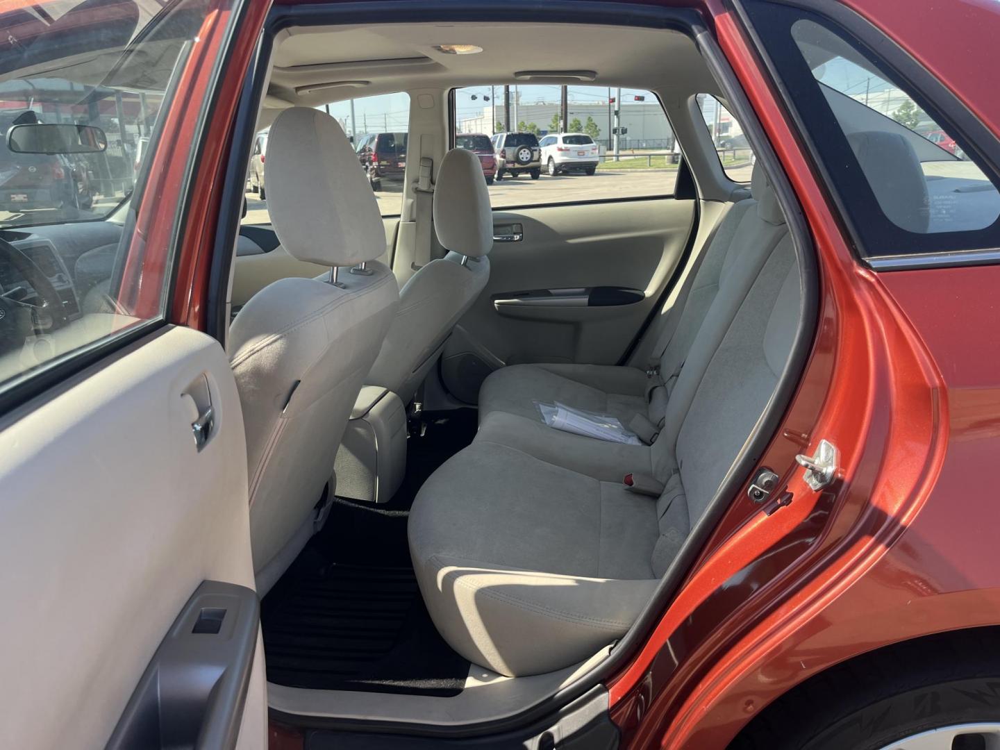 2010 Orange Subaru Impreza 2.5i Premium 4-Door (JF1GE6B60AH) with an 2.5L H4 SOHC 16V engine, Auto transmission, located at 14700 Tomball Parkway 249, Houston, TX, 77086, (281) 444-2200, 29.928619, -95.504074 - Photo#9
