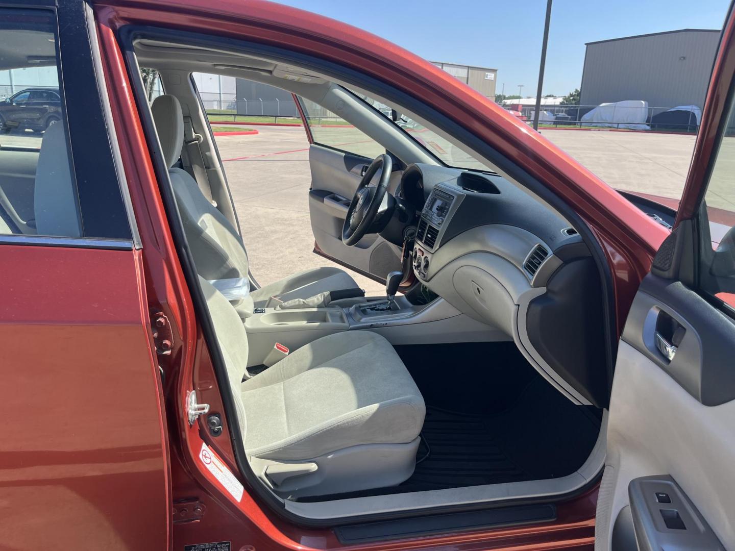 2010 Orange Subaru Impreza 2.5i Premium 4-Door (JF1GE6B60AH) with an 2.5L H4 SOHC 16V engine, Auto transmission, located at 14700 Tomball Parkway 249, Houston, TX, 77086, (281) 444-2200, 29.928619, -95.504074 - Photo#11