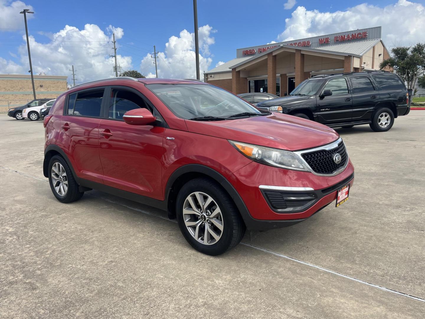 2014 red Kia Sportage LX AWD (KNDPBCAC3E7) with an 2.4L V6 DOHC 24V engine, 6-Speed Automatic transmission, located at 14700 Tomball Parkway 249, Houston, TX, 77086, (281) 444-2200, 29.928619, -95.504074 - Photo#0