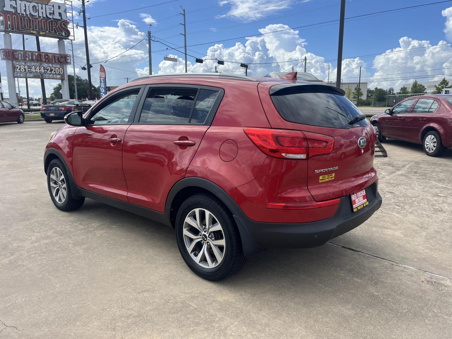 2014 red Kia Sportage LX AWD (KNDPBCAC3E7) with an 2.4L V6 DOHC 24V engine, 6-Speed Automatic transmission, located at 14700 Tomball Parkway 249, Houston, TX, 77086, (281) 444-2200, 29.928619, -95.504074 - Photo#4