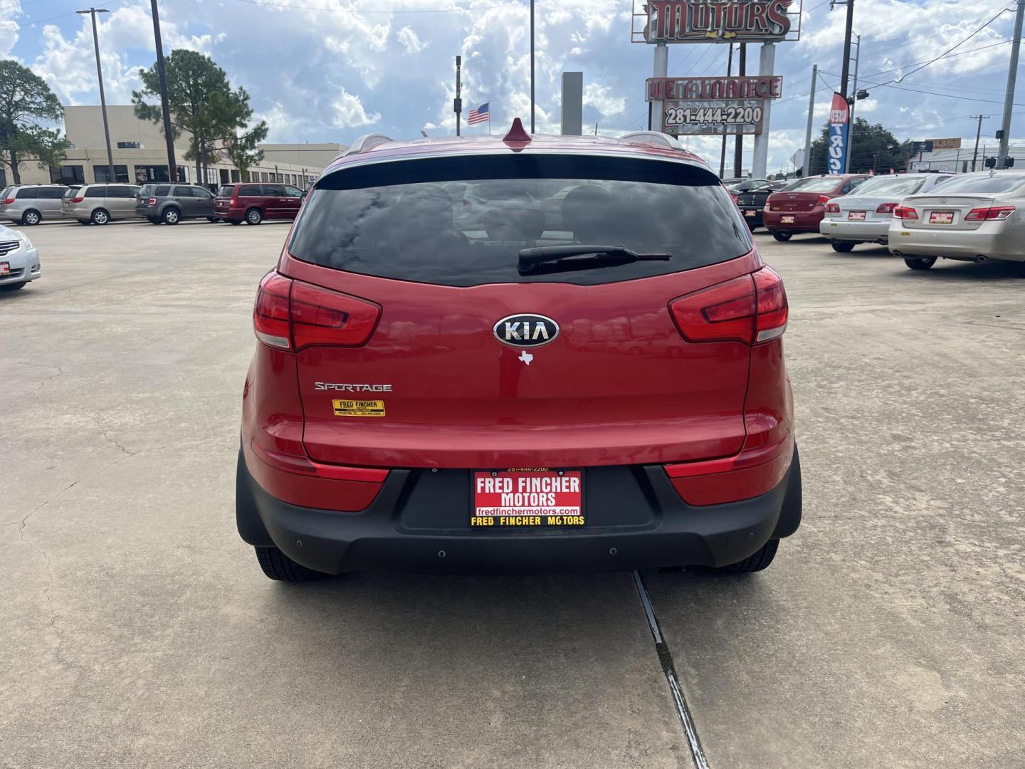 2014 red Kia Sportage LX AWD (KNDPBCAC3E7) with an 2.4L V6 DOHC 24V engine, 6-Speed Automatic transmission, located at 14700 Tomball Parkway 249, Houston, TX, 77086, (281) 444-2200, 29.928619, -95.504074 - Photo#5