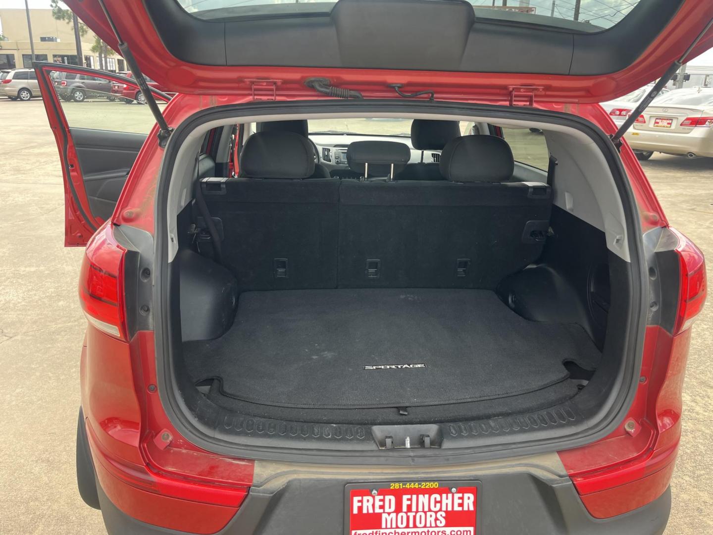 2014 red Kia Sportage LX AWD (KNDPBCAC3E7) with an 2.4L V6 DOHC 24V engine, 6-Speed Automatic transmission, located at 14700 Tomball Parkway 249, Houston, TX, 77086, (281) 444-2200, 29.928619, -95.504074 - Photo#13