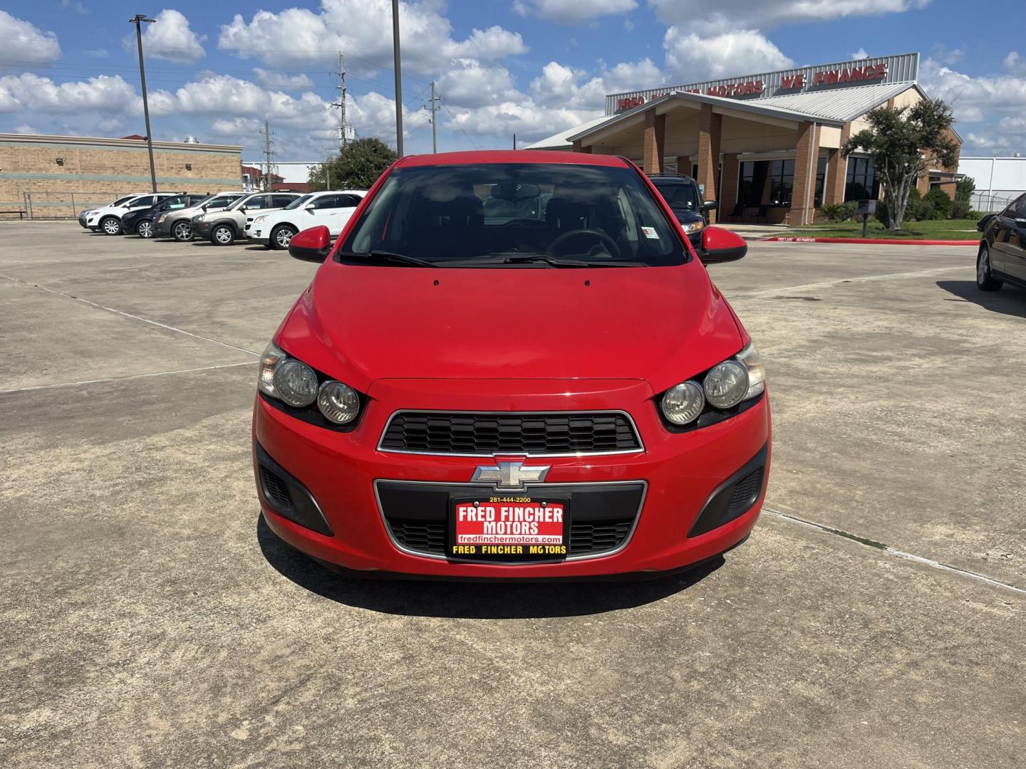 2015 red Chevrolet Sonic LT Auto 5-Door (1G1JC6SH3F4) with an 1.8L L4 DOHC 24V engine, 6-Speed Automatic transmission, located at 14700 Tomball Parkway 249, Houston, TX, 77086, (281) 444-2200, 29.928619, -95.504074 - Photo#1