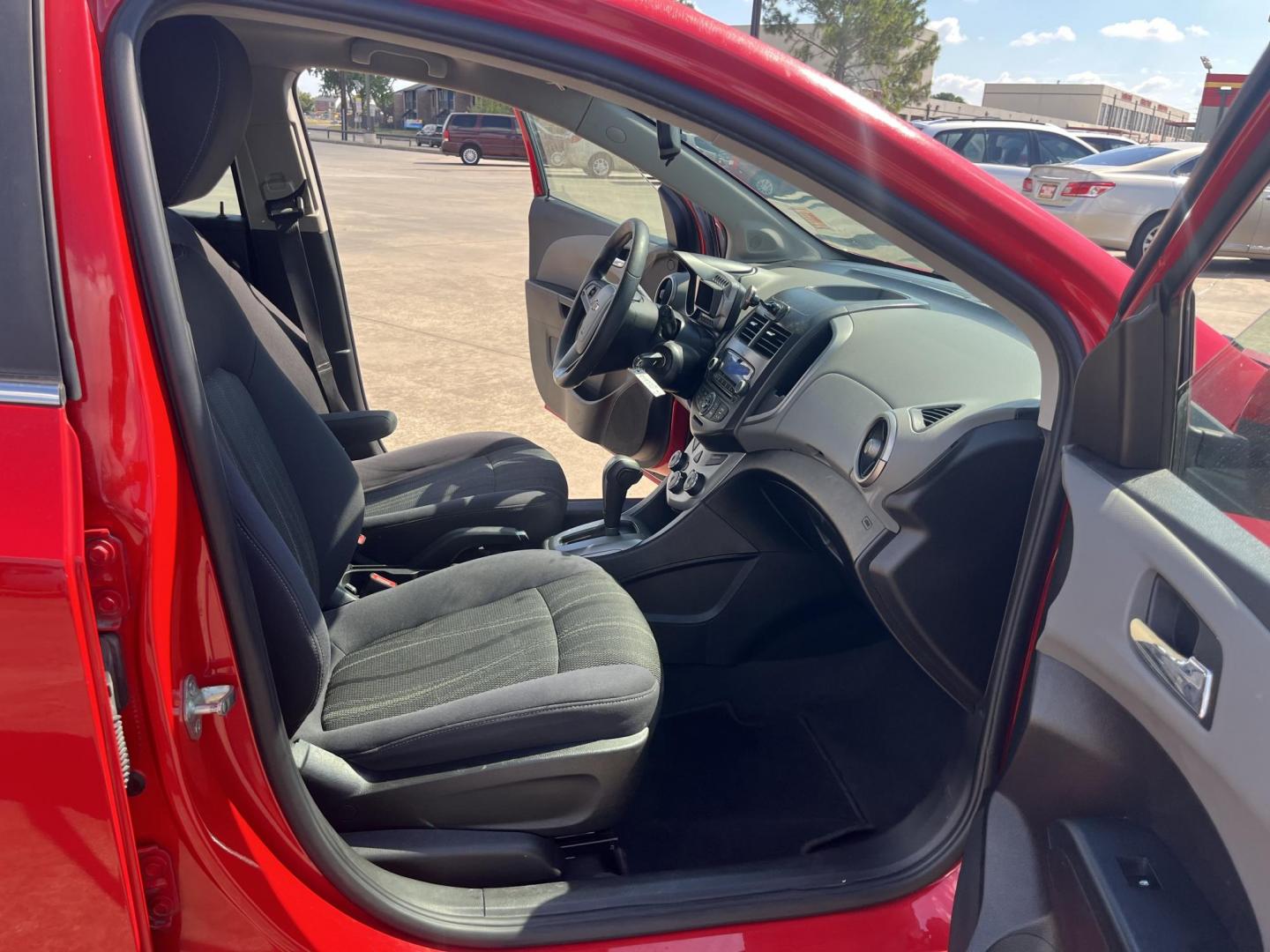 2015 red Chevrolet Sonic LT Auto 5-Door (1G1JC6SH3F4) with an 1.8L L4 DOHC 24V engine, 6-Speed Automatic transmission, located at 14700 Tomball Parkway 249, Houston, TX, 77086, (281) 444-2200, 29.928619, -95.504074 - Photo#11