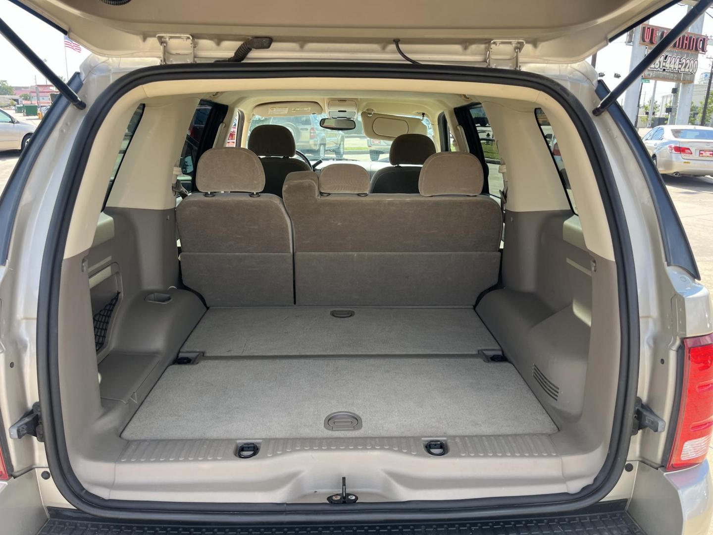 2004 GOLD Ford Explorer XLT 4.0L 2WD (1FMZU63K34U) with an 4.0L V6 SOHC 12V FFV engine, 5-Speed Automatic Overdrive transmission, located at 14700 Tomball Parkway 249, Houston, TX, 77086, (281) 444-2200, 29.928619, -95.504074 - Photo#13