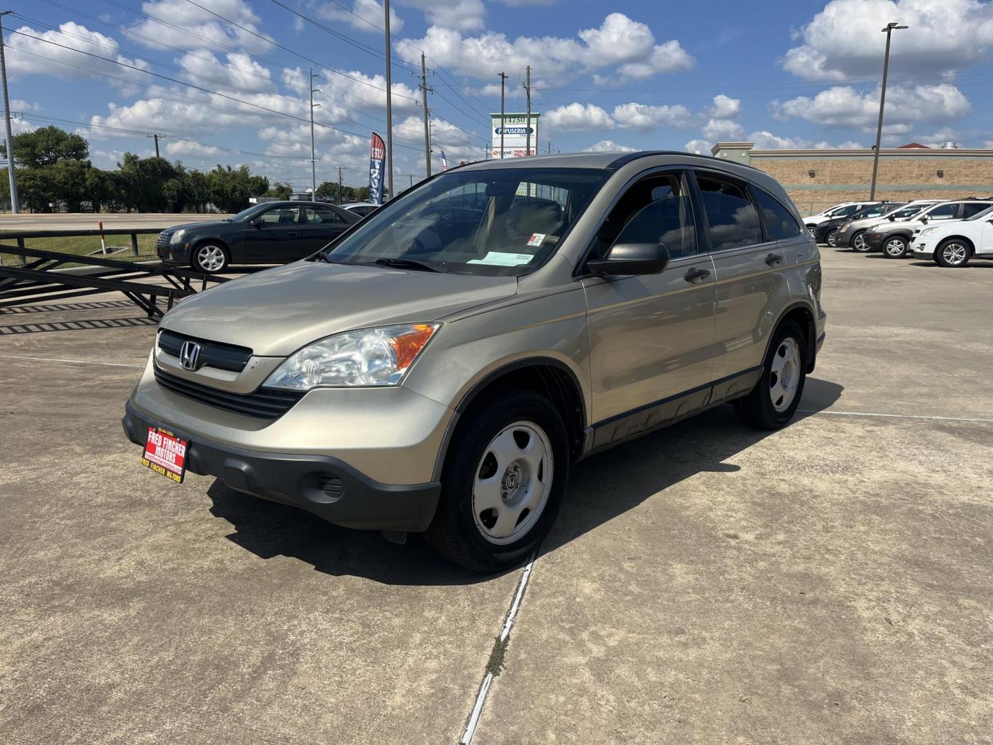 2009 GOLD Honda CR-V LX 2WD 5-Speed AT (3CZRE38339G) with an 2.4L L4 DOHC 16V engine, 5-Speed Automatic transmission, located at 14700 Tomball Parkway 249, Houston, TX, 77086, (281) 444-2200, 29.928619, -95.504074 - Photo#2