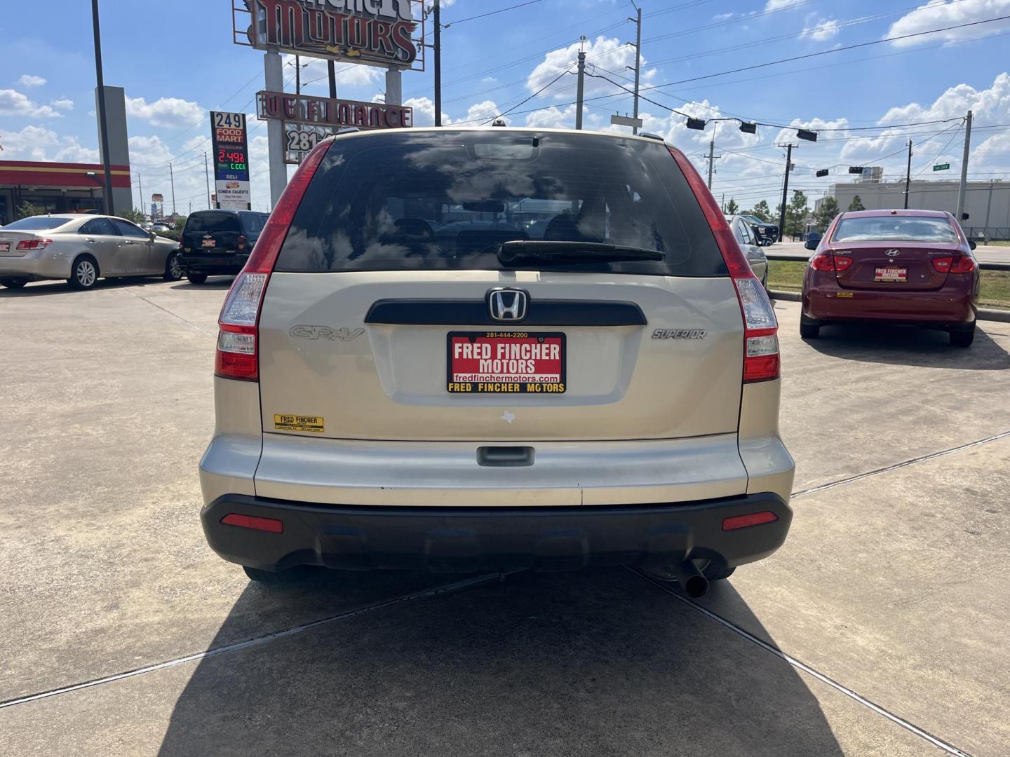 2009 GOLD Honda CR-V LX 2WD 5-Speed AT (3CZRE38339G) with an 2.4L L4 DOHC 16V engine, 5-Speed Automatic transmission, located at 14700 Tomball Parkway 249, Houston, TX, 77086, (281) 444-2200, 29.928619, -95.504074 - Photo#5