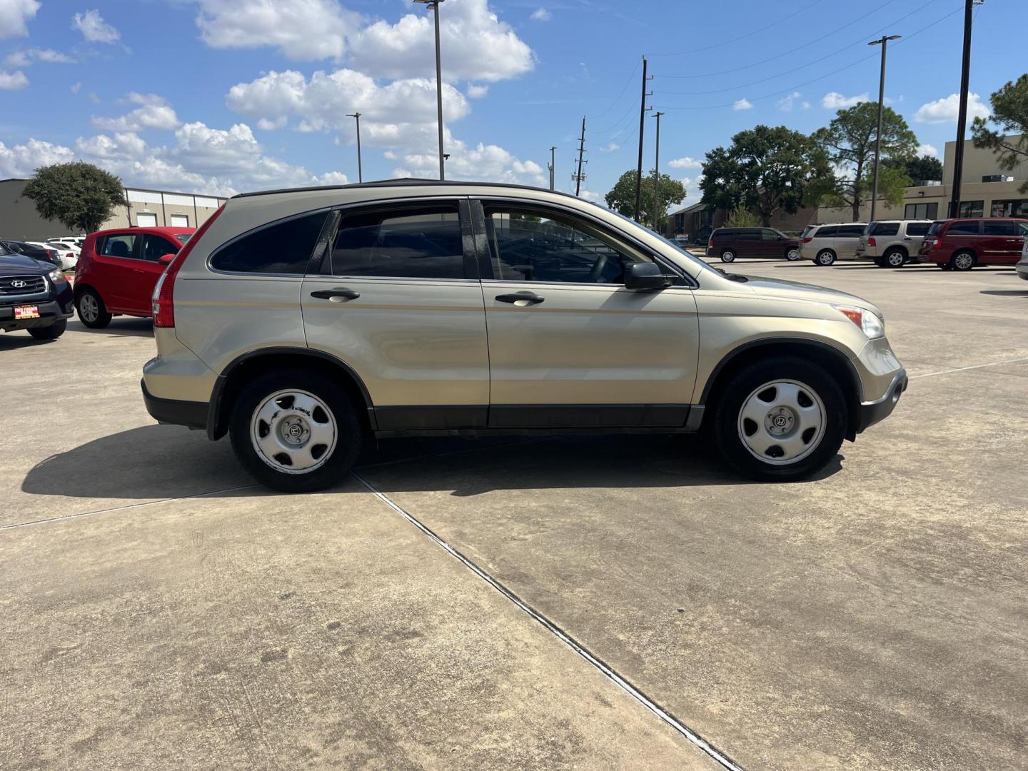 2009 GOLD Honda CR-V LX 2WD 5-Speed AT (3CZRE38339G) with an 2.4L L4 DOHC 16V engine, 5-Speed Automatic transmission, located at 14700 Tomball Parkway 249, Houston, TX, 77086, (281) 444-2200, 29.928619, -95.504074 - Photo#7