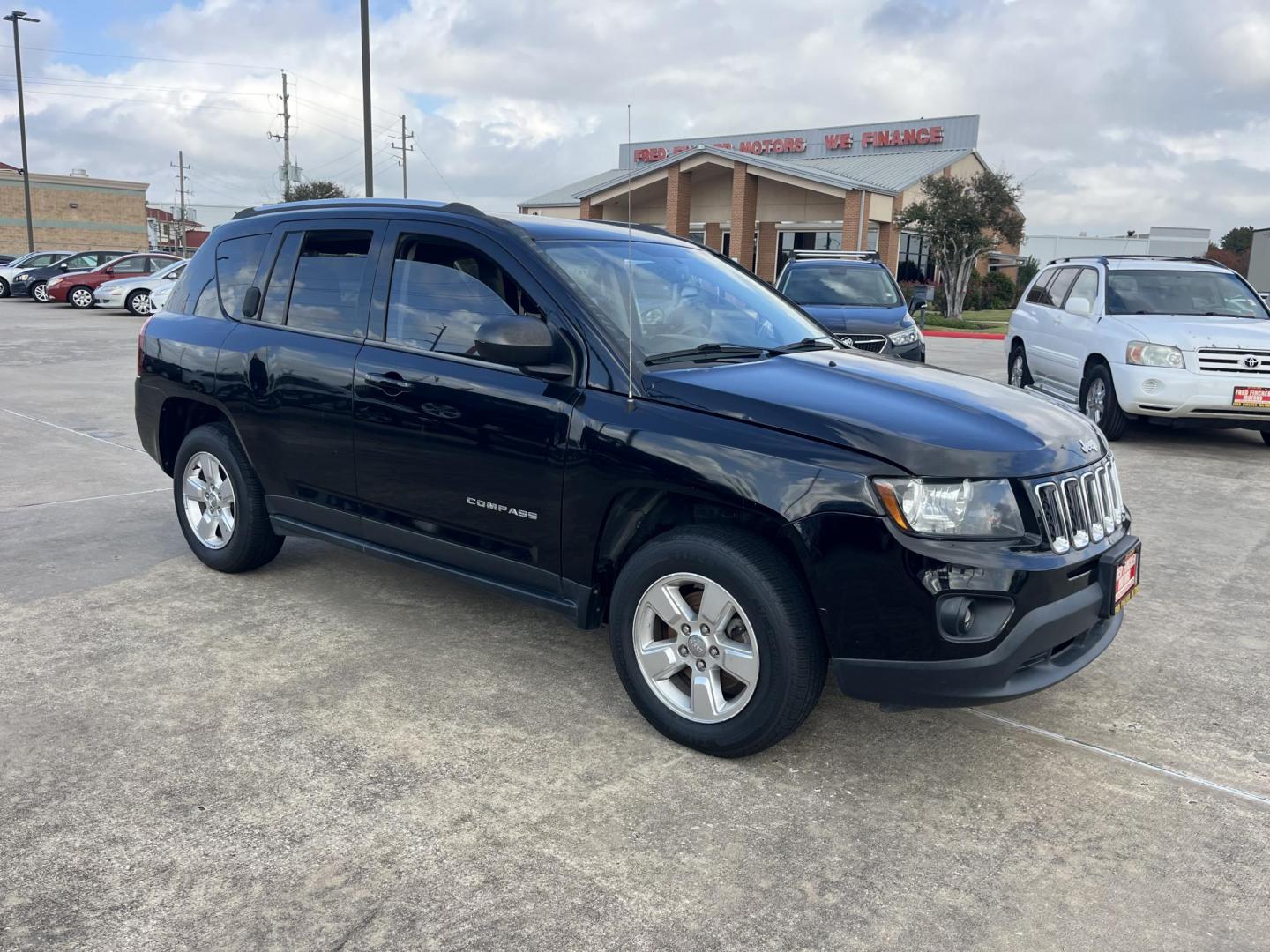 2014 black Jeep Compass Sport FWD (1C4NJCBAXED) with an 2.0L L4 DOHC 16V engine, located at 14700 Tomball Parkway 249, Houston, TX, 77086, (281) 444-2200, 29.928619, -95.504074 - Photo#0
