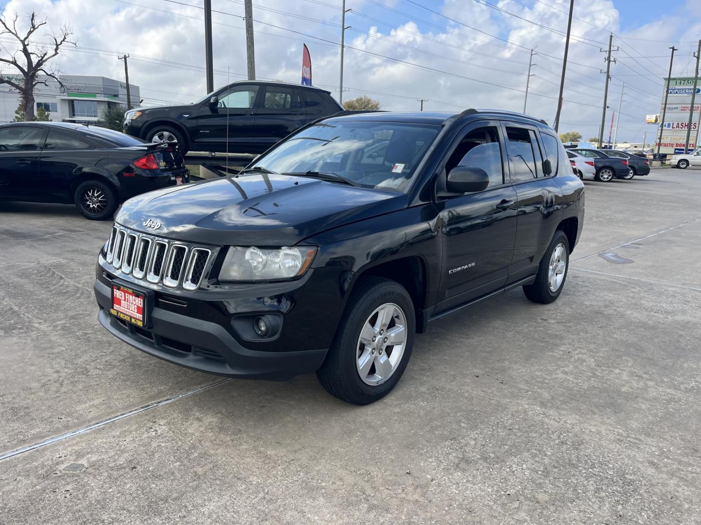 2014 black Jeep Compass Sport FWD (1C4NJCBAXED) with an 2.0L L4 DOHC 16V engine, located at 14700 Tomball Parkway 249, Houston, TX, 77086, (281) 444-2200, 29.928619, -95.504074 - Photo#2